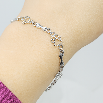 ZILVEREN HONDENPOOT EN BOT BEDELARMBAND