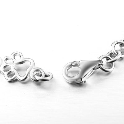 ZILVEREN HONDENPOOT EN BOT BEDELARMBAND