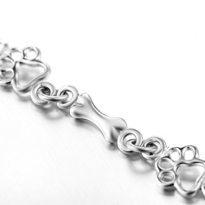 ZILVEREN HONDENPOOT EN BOT BEDELARMBAND
