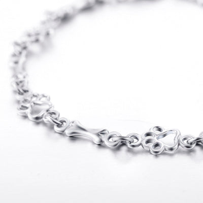 ZILVEREN HONDENPOOT EN BOT BEDELARMBAND