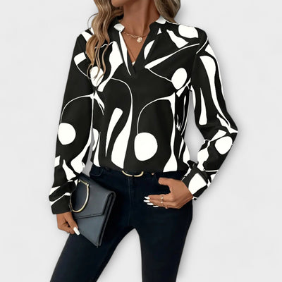 Elegante blouse met lange mouwen en spitse halslijn