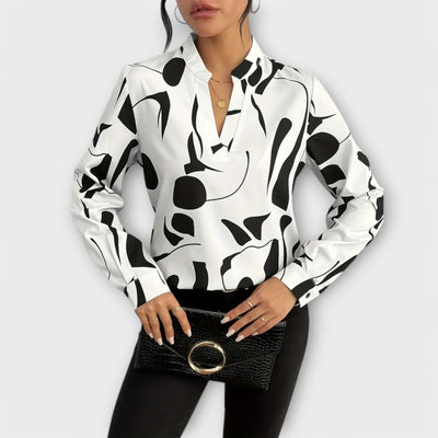 Elegante blouse met lange mouwen en spitse halslijn